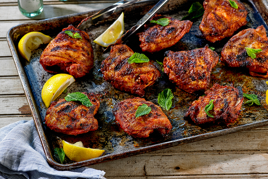 Smoked Paprika and Garlic Dusted Chicken Thighs on a baking sheet