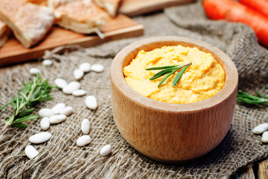 Wooden bowl with White Bean Rosemary Hummus