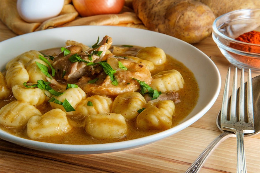 Bowl of Whole Wheat Potato Gnocchi with Spinach, Garlic, and Sweet Potatoes