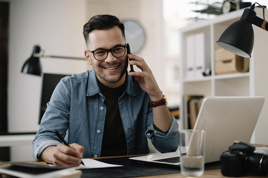 Man on the phone at desk