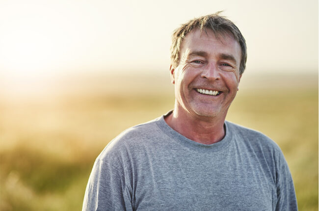 Man outside smiling