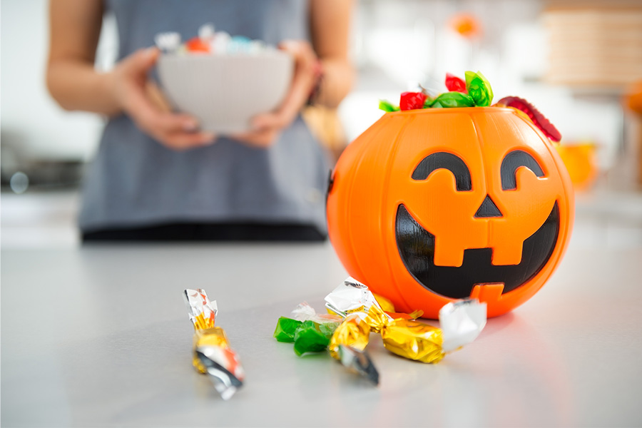 Closeup on halloween bucket full of trick or treat candy