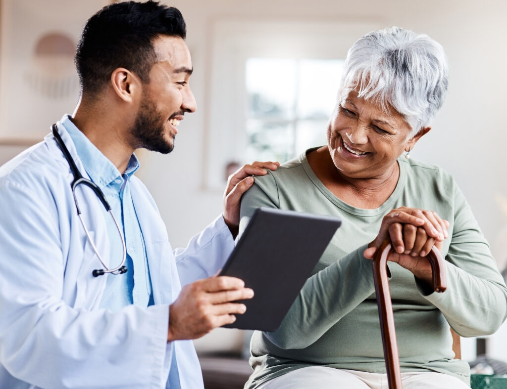 Male doctor with happy female patient.