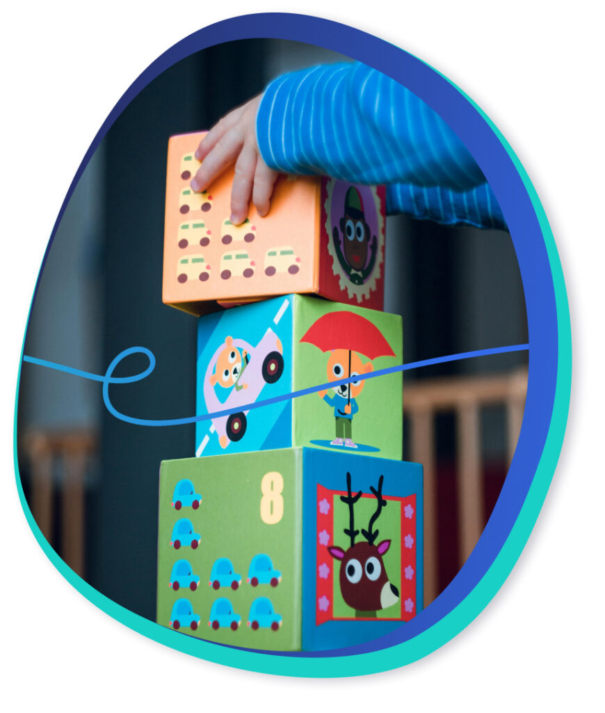 Child playing with learning blocks.