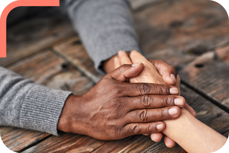 imgCorner sml Two hands holding each other.