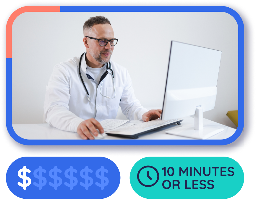 Male doctor smiling at computer screen.